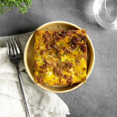 Lasagna con cremoso di zucca e besciamella, scamorza affumicata e salsiccia